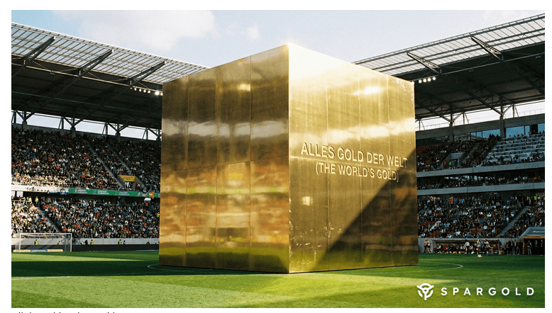 Illustration showing that all the gold mined over thousands of years could fit inside a stadium centre or a cube about 22 metres on each side.